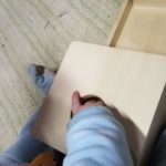 baby hand in object permanence box